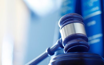 Australia’s major banks settle class actions, Core Lithium’s shares surge and AGL board defeated