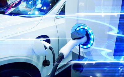 EV push sees more than 100 companies unite, TPG calls on Bank of America and GrainCorp surges on wheat prices