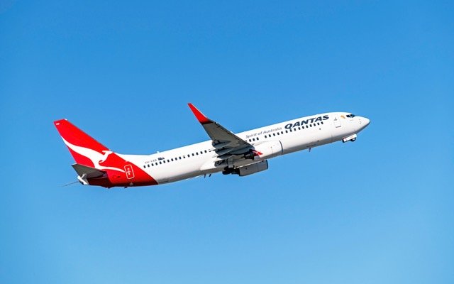 Qantas posts $1.4b profit, Domino’s Pizza plunges on lower sales and consortium revises Origin Energy bid